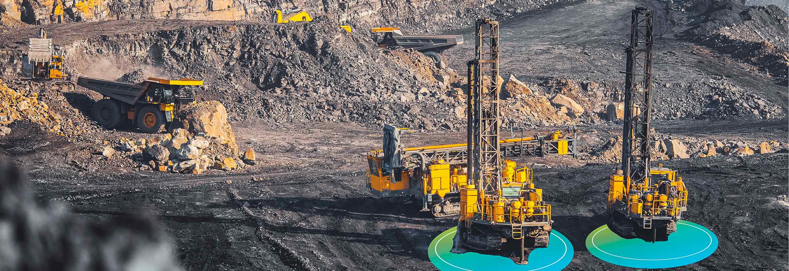 Guided drill rigs in operation
